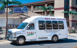 Coops Cab - A photo of Coops Cab taxi service vehicle in front of the Put-in-Bay Resort.